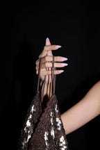 Strawberry Milkshake press-on nails — styled hand detail