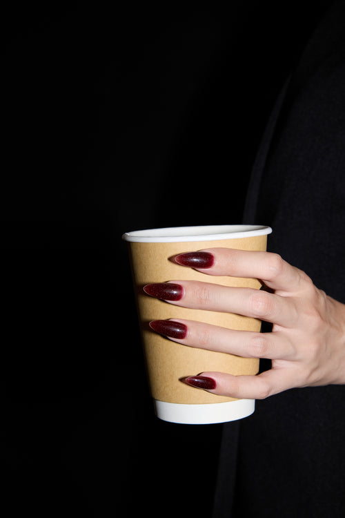 Cherry Milkshake press-on nails — styled hand detail