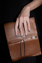 Aqua French press-on nails — styled hand detail