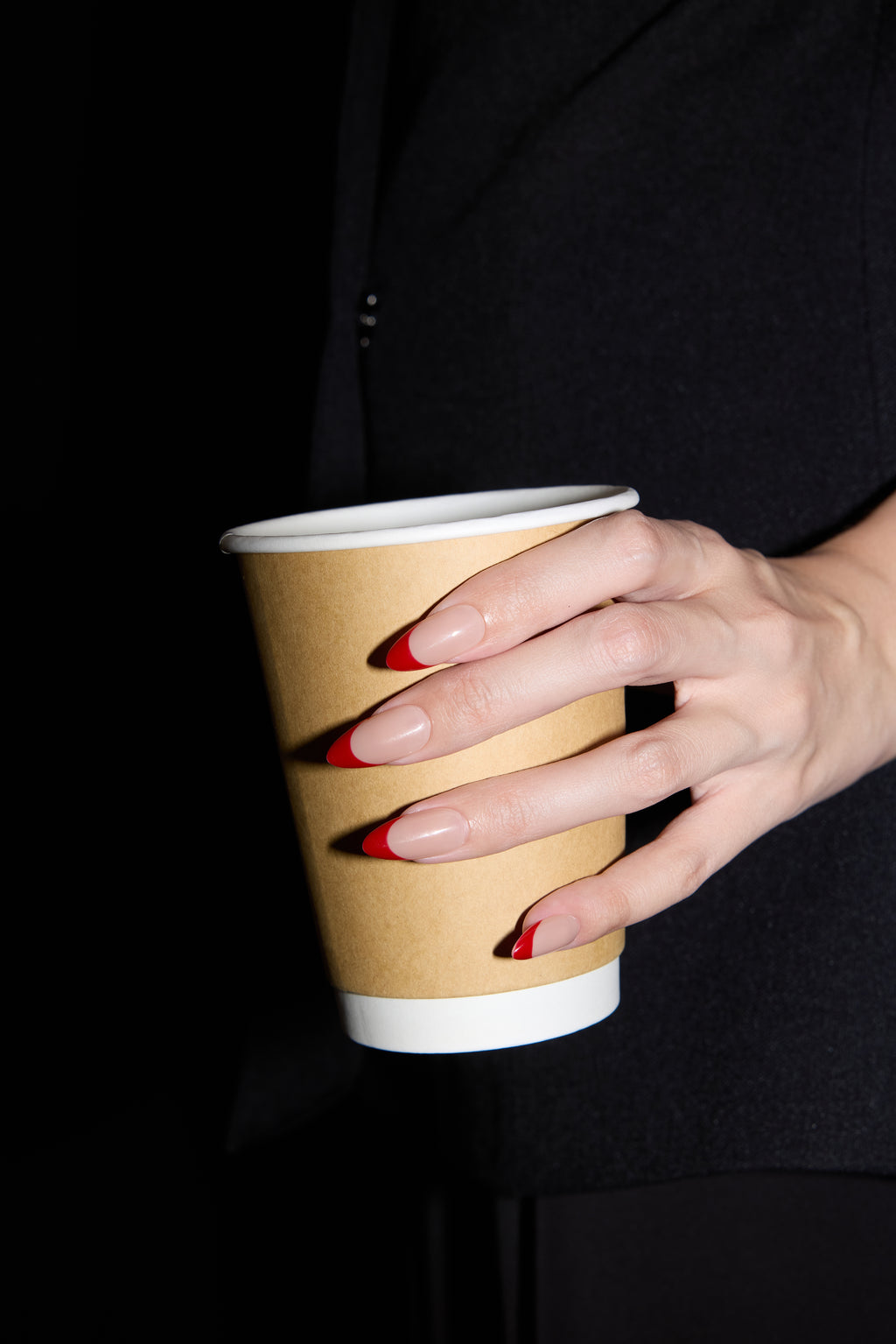 Cherry French press-on nails — styled hand detail