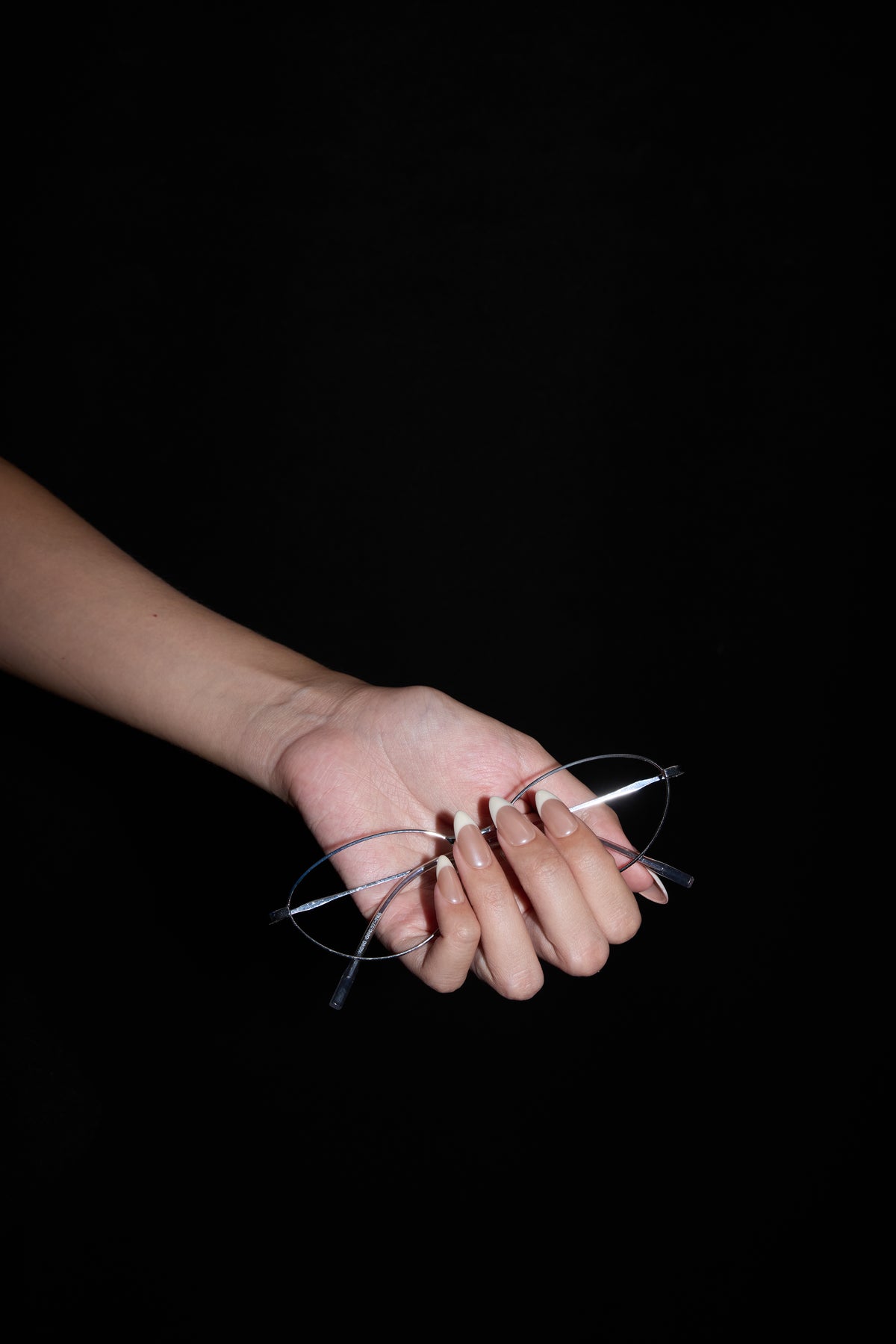 Pearl French press-on nails — styled hand detail