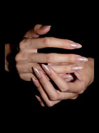 Pink Aura French press-on nails — stacked hands