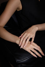 Pink Aura French press-on nails — styled hand detail